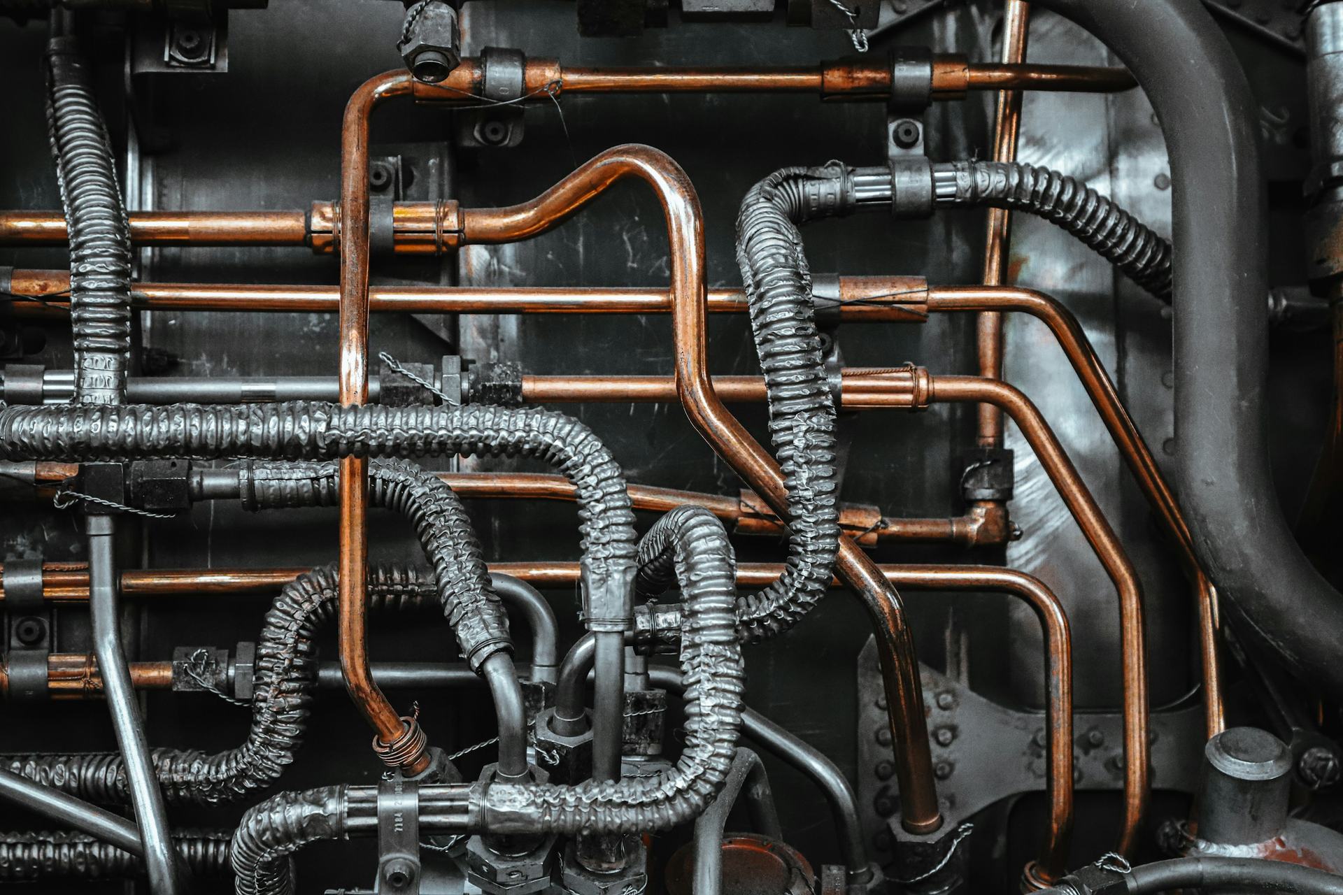 Copper refrigerant lines and insulated hoses, close up